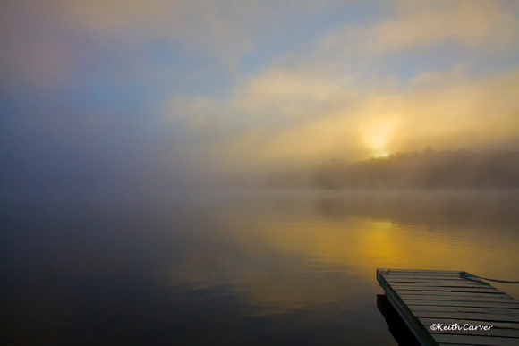 Sunrise and fog on the lake